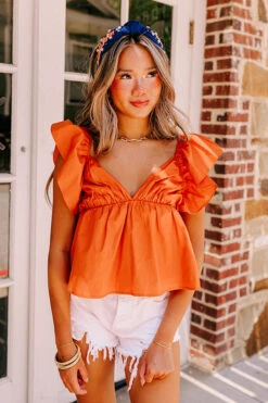 Stay Here Awhile Peplum Top In Rust -Chic Essence 2307035240000 2023071810200400 b825b9fcstay here awhile peplum top in rust